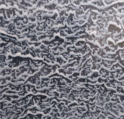 Detailfoto wolkjesemaille van de heksenketel
